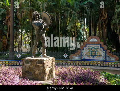 Festive man or El Fiestero statue, botanical park, Malaga, Andalusia, Spain Stock Photo