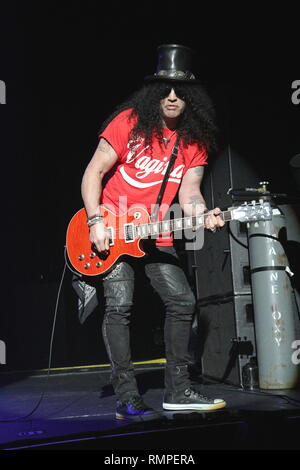 Guitarist and songwriter Saul Hudson, better known by his stage name Slash is shown performing on stage during a 'live' concert appearance with his solo band. Stock Photo