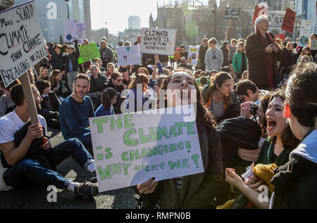 London, UK. 15th Feb, 2019. Students stop the traffic in front of the Houses of Parliament to protest against climate change. Thousands of primary school children, teenagers and university students have walked out of lessons today in more than 40 cities and towns of the UK to protest against climate change and urge the government to take action.The global movement has been inspired by teenage activist Greta Thunberg, who has been skipping school every Friday since August to protest outside the Swedish parliament. Credit: Angeles Rodenas/SOPA Images/ZUMA Wire/Alamy Live News Stock Photo