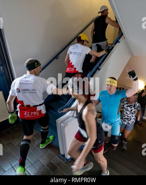 Hannover, Germany. 16th Feb, 2019. Participants of the Vertical Marathon World Championship run up the stairs in the high-rise building of the Annastift in Hanover. At the event, the runners bridge the marathon distance of 42,192 kilometres, but run up and down 83 808 steps in the stairwell of a skyscraper. Credit: Peter Steffen/dpa/Alamy Live News Stock Photo