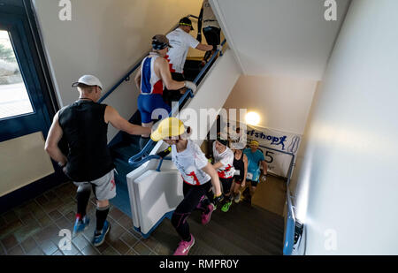 Hannover, Germany. 16th Feb, 2019. Participants of the Vertical Marathon World Championship run up the stairs in the high-rise building of the Annastift in Hanover. At the event, the runners bridge the marathon distance of 42,192 kilometres, but run up and down 83 808 steps in the stairwell of a skyscraper. Credit: Peter Steffen/dpa/Alamy Live News Stock Photo