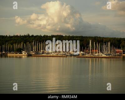 Afternoon light shining on the masts in a marina in the Turku Archipelago, Finland Stock Photo