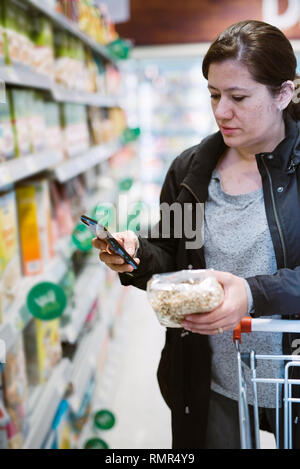 Woman doing the groceries shopping Stock Photo