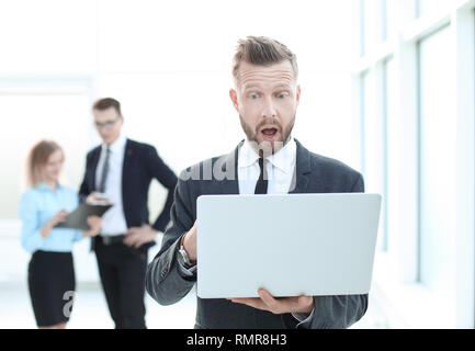 close up.astonished businessman looking at laptop screen Stock Photo