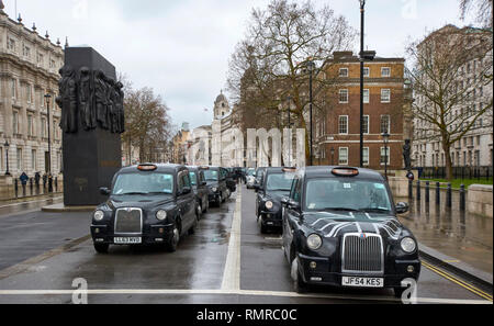 LONDON WHITEHALL NEAR MEMORIAL TO WOMEN OF WORLD WAR TWO BLACK CABS TAXI  LARGE DEMONSTRATION ON FEBRUARY 8 2019
