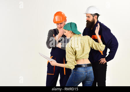 Discussing a new project. Group of constructing engineers and architects at work. Professional people working on construction design. Men and woman Stock Photo