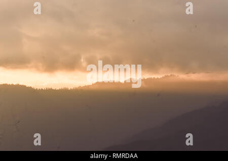Storm Clouds closeup on the mountain range Sky Background. panorama vivid sky. Panoramic of a twilight sunset and colorful clouds. sunlight reflecting Stock Photo