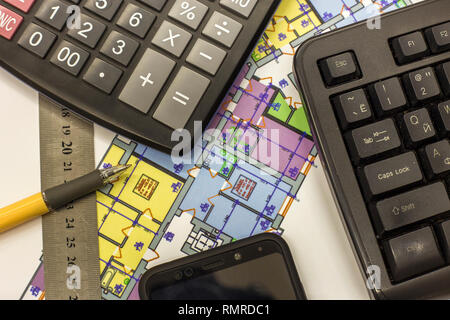 Calcurator, pen and ruler on building house architecture plan drawing blueprint. Planning, measurement and investments concept. Stock Photo