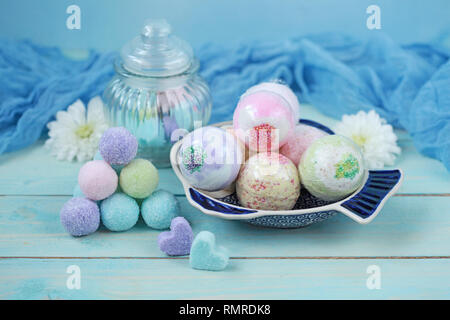 Handmade fragrant multicolored bath balls (bombs) and sugar scrub for hands. Selection focus on some balls. Stock Photo