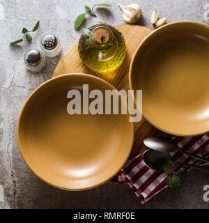 empty plates on the table, table setting for dinner or lunch. stylish kitchenware Stock Photo