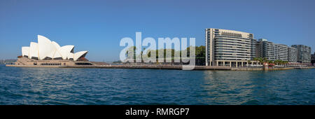 The Sydney Opera House and the apartments built next to it on Bennelong Point on a summer day with a clear sky Stock Photo