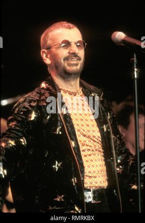 Former Beatle drummer Ringo Starr is shown performing on stage during a 'live' concert appearance with Ringo Starr & His All Starr Band. Stock Photo