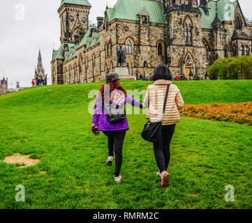 Ottawa, Canada - May 14, 2017. Asian women visiting the Parliament Buildings in Ottawa, Canada. Stock Photo