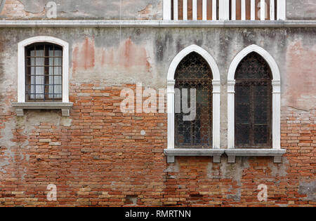 Detail of the ruined facade of a historic building in Venice, Italy Stock Photo