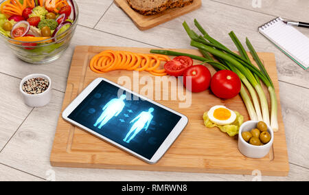 Arrangement of healthy Ingredients with a tablet. Dieting concept Stock Photo