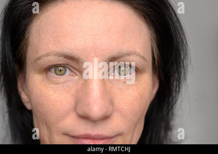 Nose And Eyes Of A Green Eyed Woman With Dark Brown Hair