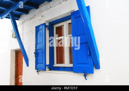 Blue Shuttered Window in Mykonos, Greece. Stock Photo