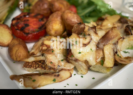Assorted vegetarian plate with porcini mushroom bruschetta Stock Photo