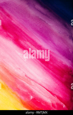 Colorful watercolor background of diagonal brush strokes from dark blue through pink to yellow shades. Abstract hand-drawn gradient painting. Stock Photo