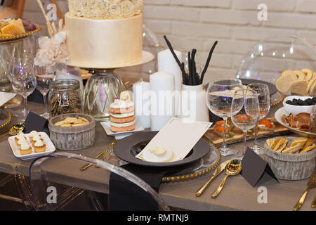 Close up of a fully set banquet table with brown and earth tones Stock Photo