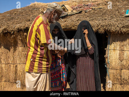 Rashaida old man with his veiled wives, Kassala State, Kassala, Sudan Stock Photo