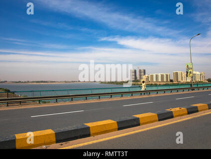 Sudanese man crossing a bridge over river Nile, Khartoum State, Khartoum, Sudan Stock Photo