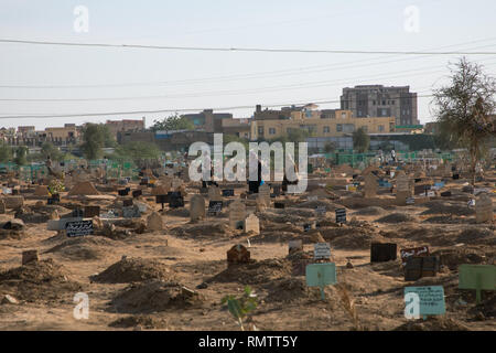 Sudanese people in the cemetery near sheikh Hamad el nil tomb, Khartoum State, Omdurman, Sudan Stock Photo