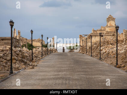 Renovated alley in the middle of ruined ottoman coral buildings, Red Sea State, Suakin, Sudan Stock Photo