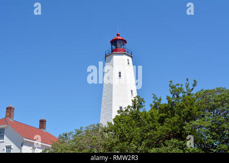 Red and White Lighthouse in Sandy Hook New Jersey Stock Photo