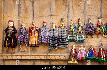 Colorful Rajasthan puppets hanging in the shop of Jaisalmer City Palace, India Stock Photo