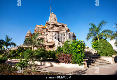 Jain temple from sandstone and tropical garden in Nasik, Maharashtra, India Stock Photo