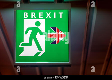 The emergency exit sign shows the direction of escape in case leave European Union. The board indicate way for Brexit. Stock Photo