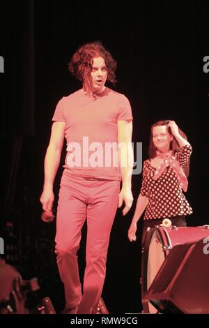 Musicians Jack White and Meg White of the rock band The White Stripes are shown performing on stage during a 'live' concert appearance. Stock Photo