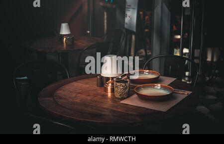 Reserved dining table in vintage style, Restaurant outdoor Stock Photo