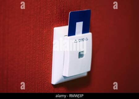 Closeup of hotel room door and lights electronic card in the wall Selected focus Stock Photo