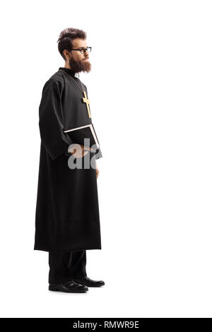 Full length shot of a priest standing and holding the Bible isolated on white background Stock Photo