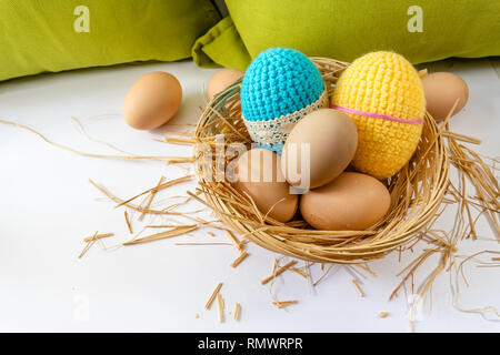 Easter eggs decoration, eggs in the nest, springtime rural composition. selective focus. Stock Photo