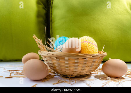 Easter eggs decoration, eggs in the nest, springtime rural composition. selective focus. Stock Photo