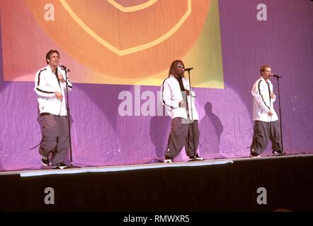 E.Y.C. (also known as Express Yourself Clearly) group members are shown on stage during a 'live' concert appearance. Stock Photo