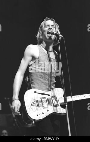 Singer, songwriter and guitarist, Jonny Lang, is shown performing on stage during a 'live' concert appearance. Stock Photo