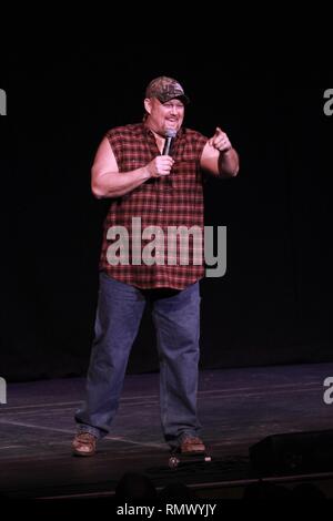 Daniel Lawrence Whitney, better known by the stage name Larry the Cable Guy, is shown performing on stage during a 'live' concert appearance. Stock Photo