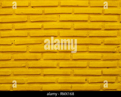 Brick wall background with yellow color. Stock Photo