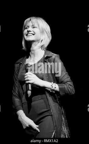 Australian pop singer, songwriter and actress Olivia Newton John is shown performing on stage during a 'live' concert appearance. Stock Photo