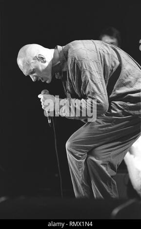 Singer Peter Garrett is shown performing on stage during a 'live' concert appearance with Midnight Oil. Stock Photo