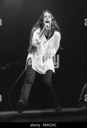 Singer and songwriter Alanis Morissette is shown performing on stage during a 'live' concert appearance. Stock Photo