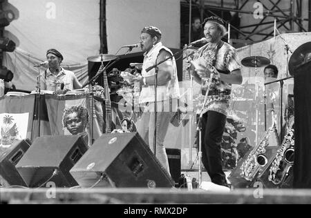 Band members of the Neville Brothers are shown performing on stage at Woodstock '94. Stock Photo