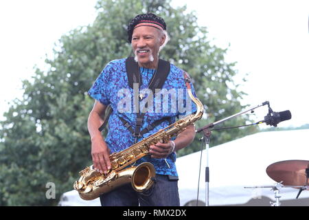 Saxophonist Charles Neville is shown performing on stage during a 'live' concert appearance with his solo band. Stock Photo