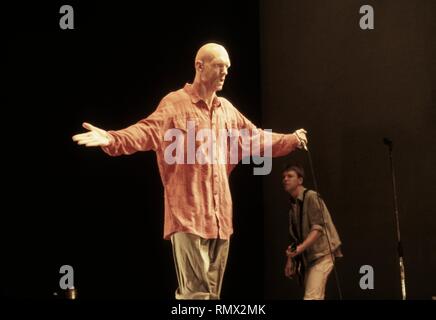 Singer Peter Garrett of the Australian rock band Midnight Oil is shown performing on stage during a 'live' concert appearance. Stock Photo