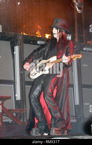 Guitarist Mick Mars of the heavy metal band Motley Crue is shown performing on stage during a 'live' concert appearance. Stock Photo