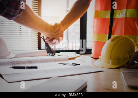 Real estate concept, architect shake hands with engineer or constructor worker, successful planning and meeting about home, house and resident constru Stock Photo